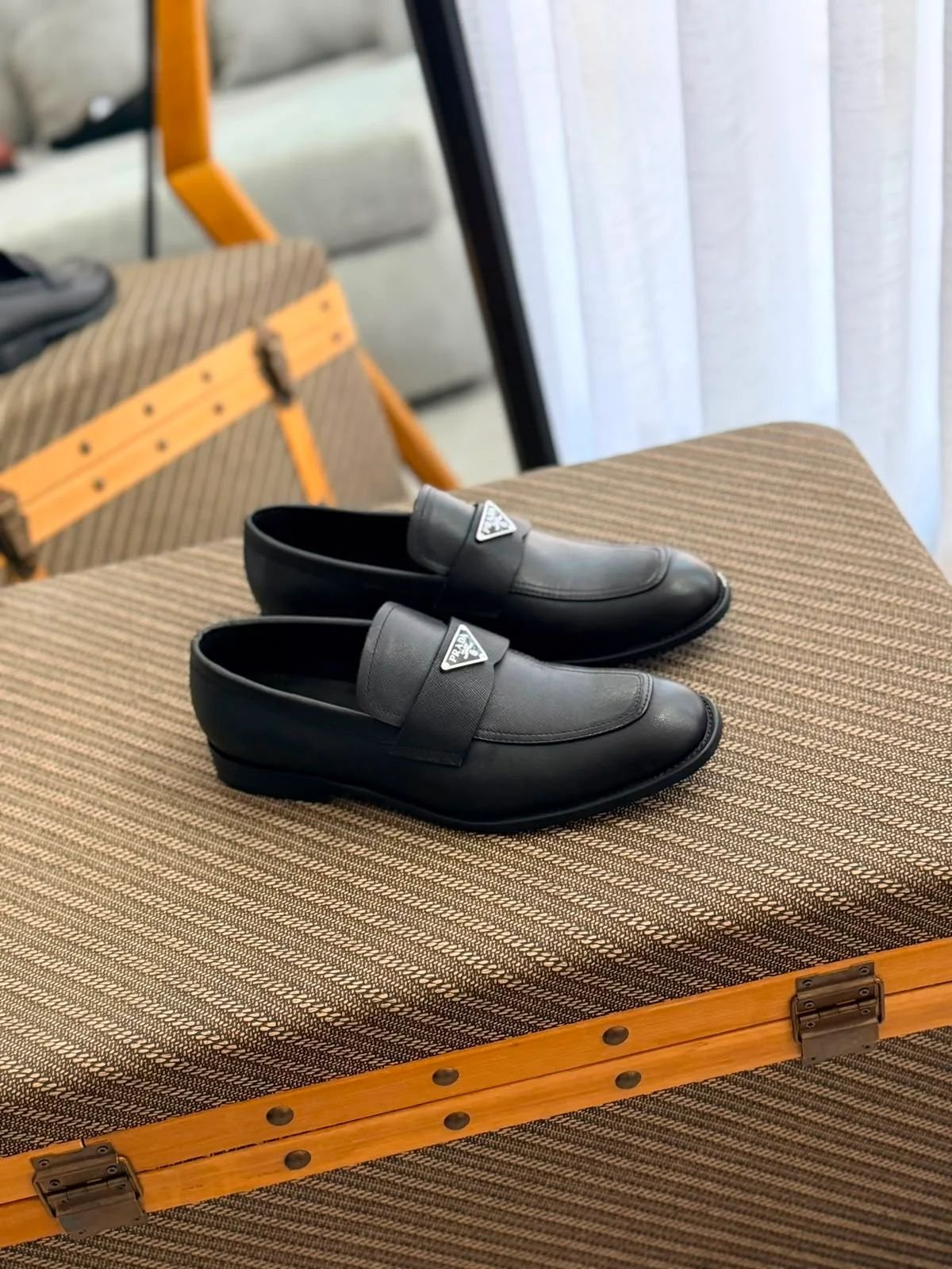 Prada Plaque Leather Loafers